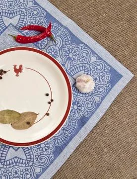 Empty round ceramic plate on tablecloth top view Stock Photos