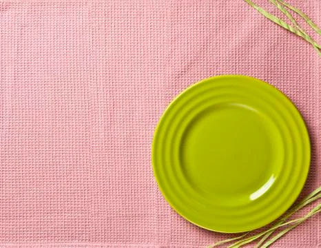 Empty round ceramic plate on tablecloth top view Stock Photos