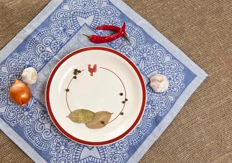 Empty round ceramic plate on tablecloth top view Stock Photos