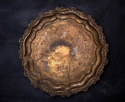 Empty round copper plate with monograms Stockfoto's