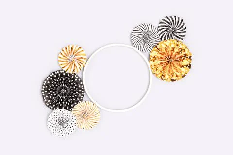 Empty round frame and paper fans on a blue background. Stock Photos