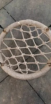 Empty Round Net Nest Swing Hanging on Chains at Outdoor Children Playground 스톡 사진