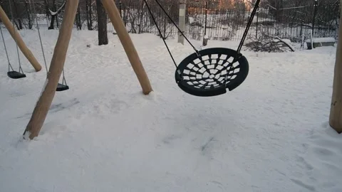 Empty Round net Swing Moving in the winter. Round swing mesh Stock Footage 146319835