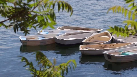 Empty row boats tied up to a dock Stock Footage 115501907