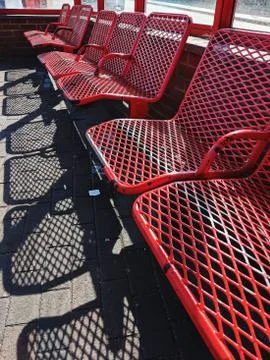 Empty row of seats at a bus stop Stock Photos