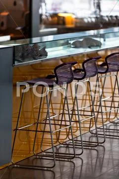 Empty row of stools at a bar Stock Photos