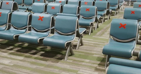 Empty rows of airport seats marked with red crosses for distance, no people Stock Footage 178546890