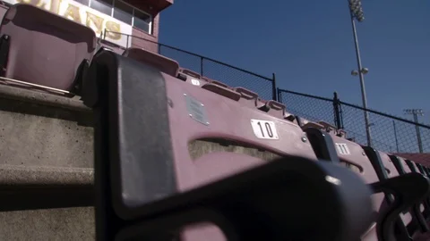 Empty rows of chairs in a high school football stadium Stock Footage 77081913