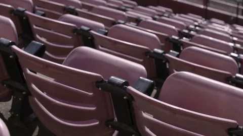 Empty rows of chairs in a high school football stadium Stock Footage 77082176