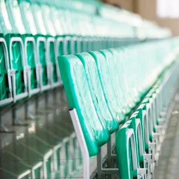 Empty rows of green chairs Stock Photos