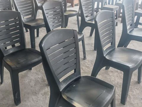 Empty rows of plastic chairs in indoor waiting area Stock Photos