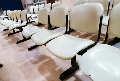 Empty rows of seating bench at public waiting area Stock Photos