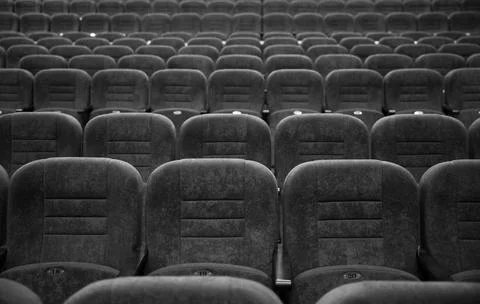 Empty rows of seats in the hall for a large number of people. Cinema and theatre Stock Photos