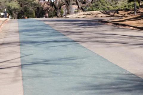 Empty running path in a park Stock Photos