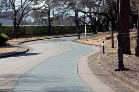 Empty running path in a park Stock Photos