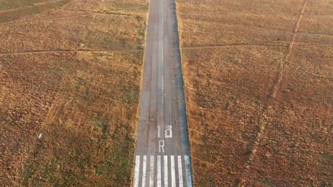 Empty runway of a small airport used for takeoff and landing of light aircraft Stock Footage 141892462