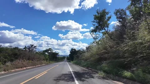 Empty Rural Highway Stretching Through Open Farmland in Piaui Brazil Beneath Stock Footage 345673126