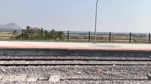 Empty Rural Train Platform and Railway Tracks at Station Stock Footage 323902998