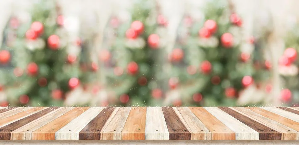 Empty rustic wood plank table top with abstract blur christmas tree red decor Stock Photos