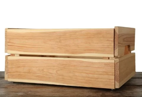 Empty rustic wooden crate on table against white background Stock Photos