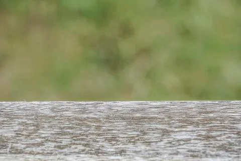 Empty rustic wooden table in front of a green spring abstract background Stock Photos