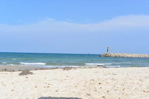 Empty sand beach and light house in Tunis Stock Photos