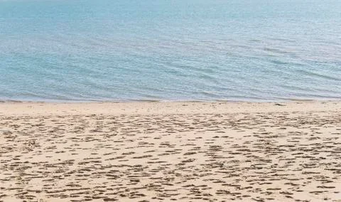 Empty sand beach and tranquil sea background Stock Photos