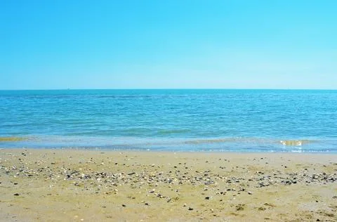 Empty sand beach background. Horizon with sky and sea Stock Photos