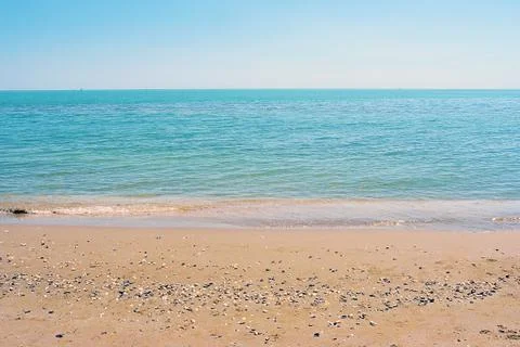 Empty sand beach background. Horizon with sky and sea Stock Photos