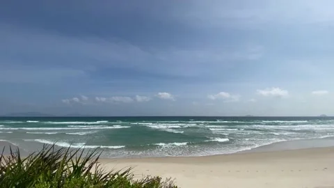 Empty sand beach with blue sea and blue sky background Stock Footage 124970705