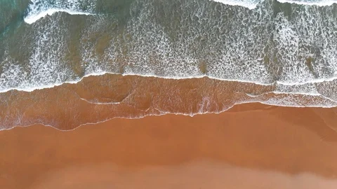 Empty sand beach with ocean waves. Aerial top down view. UHD, 4K Stock Footage 94811925