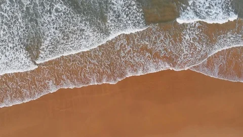 Empty sand beach with ocean waves. Aerial top down view Stock Footage 94991995