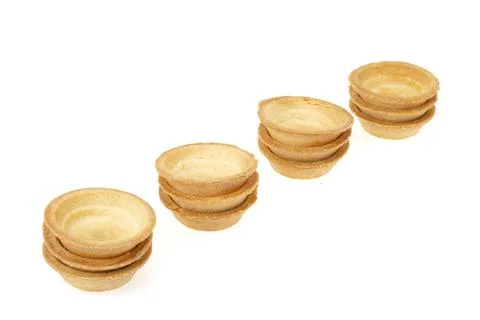 Empty sand tartlets isolated on white. Studio Photo Stock Photos