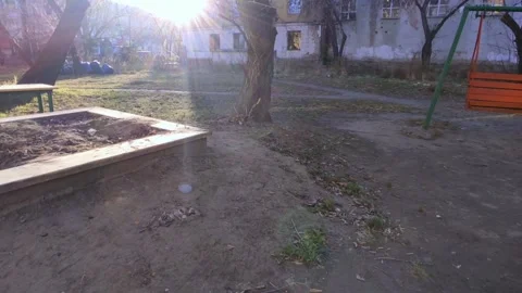 Empty sandbox with trash bags and swing bench Stock Footage 219972811