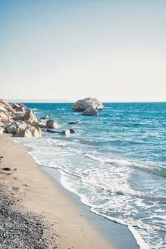 Empty Sandy Beach and Calm Sea Under Clear Blue Sky Stock Photos