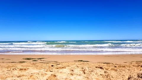 Empty sandy beach on the beach, summer. Stock Photos