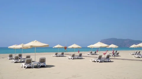 Empty sandy beach during covid 19 outbreak in summertime Stock Footage 154379678