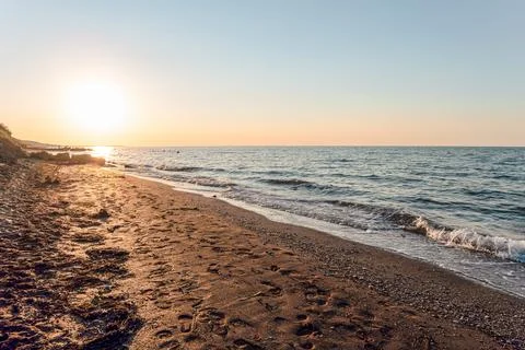 Empty sandy beach with footprints Stock Photos