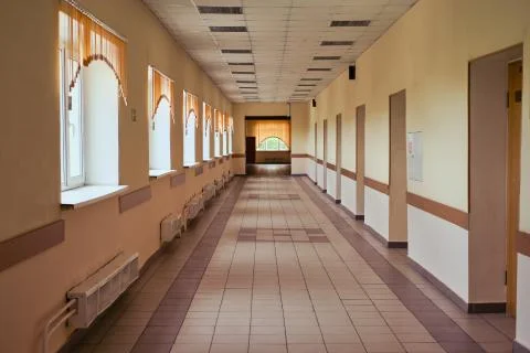 An empty school corridor during the holidays due to the coronavirus epidemic. Stock Photos