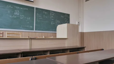 Empty School Desks In A Classroom During Quarantine. School Break. Holidays. Stock Footage 141593819