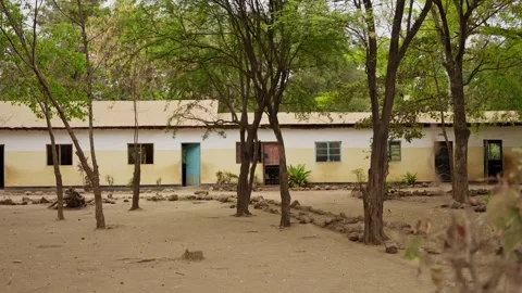Empty school ground and buildings in village or town in Africa during summer Video stock 307720898