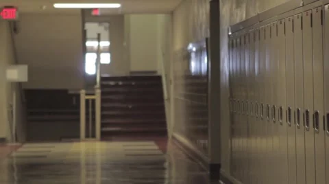 Empty school hallway dolly with lockers and stairs Stock Footage