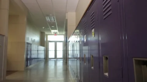 Empty school hallway with lockers, slider dolly in. Video stock 132730860