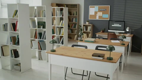 Empty School Library Showing Bookshelves and Desks for Students Stock Footage 337476288