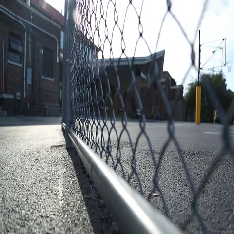 Empty school yard, chain link fence, basketball goal Video stock 69547301
