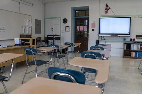 Empty schoolroom with interactive whiteboard for teaching students in high Stock Photos