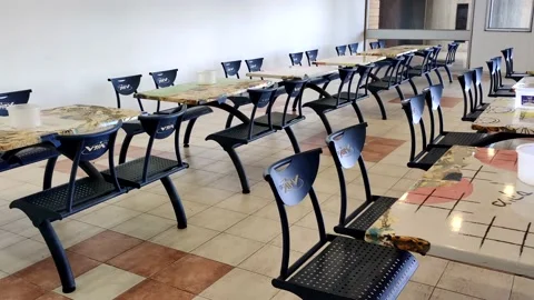 Empty scool cantine with metal seats Stock Footage 156749781