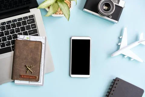 Empty screen smart phone and computer with travel items on color background Fotos Stock