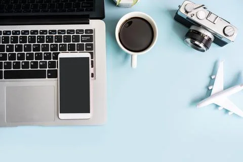 Empty screen smart phone and computer with travel items on color background Fotos Stock