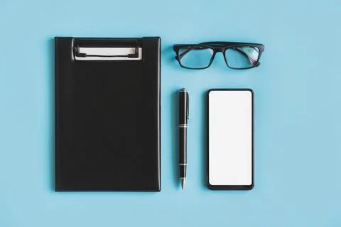 Empty screen Smart phone and file folder on business desk office with copy .. 스톡 사진